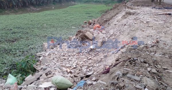 Điều tra xử lý nghiêm cá nhân, tập thể ngang nhiên đổ phế thải lấn chiếm sông Hồng